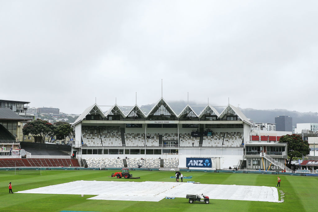 Covers lie on the wicket during a rain delay on day five of the first test match in the series...