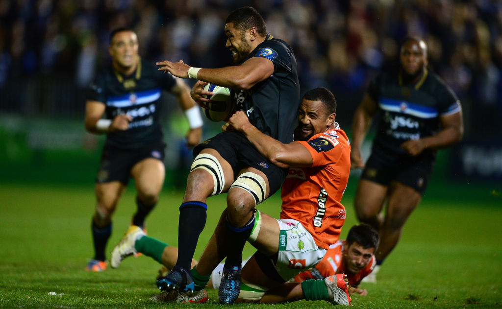 Benetton's Nasi Manu (R) tackles Bath's Taulupe Faletau during a European Rugby Champions Cup...