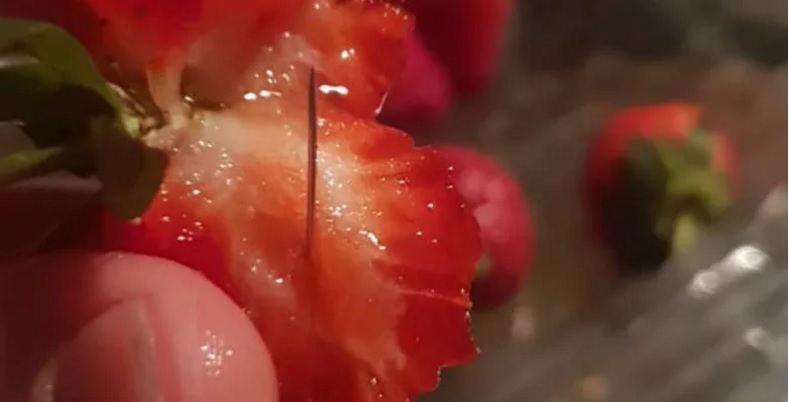 NSW mother Chantal Faugeras posted these pictures of strawberries with needles in them to...