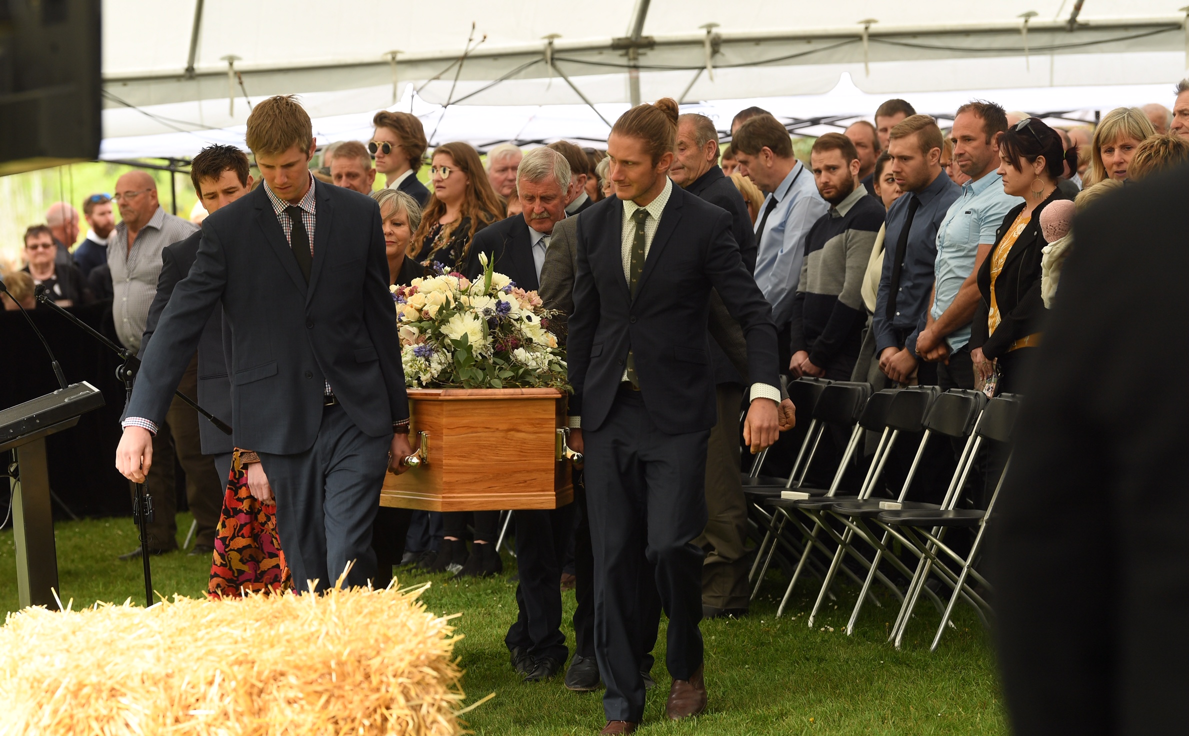 The casket with Nadine and her son Angus Tomlinson is carried to their funeral service. Photo: ODT