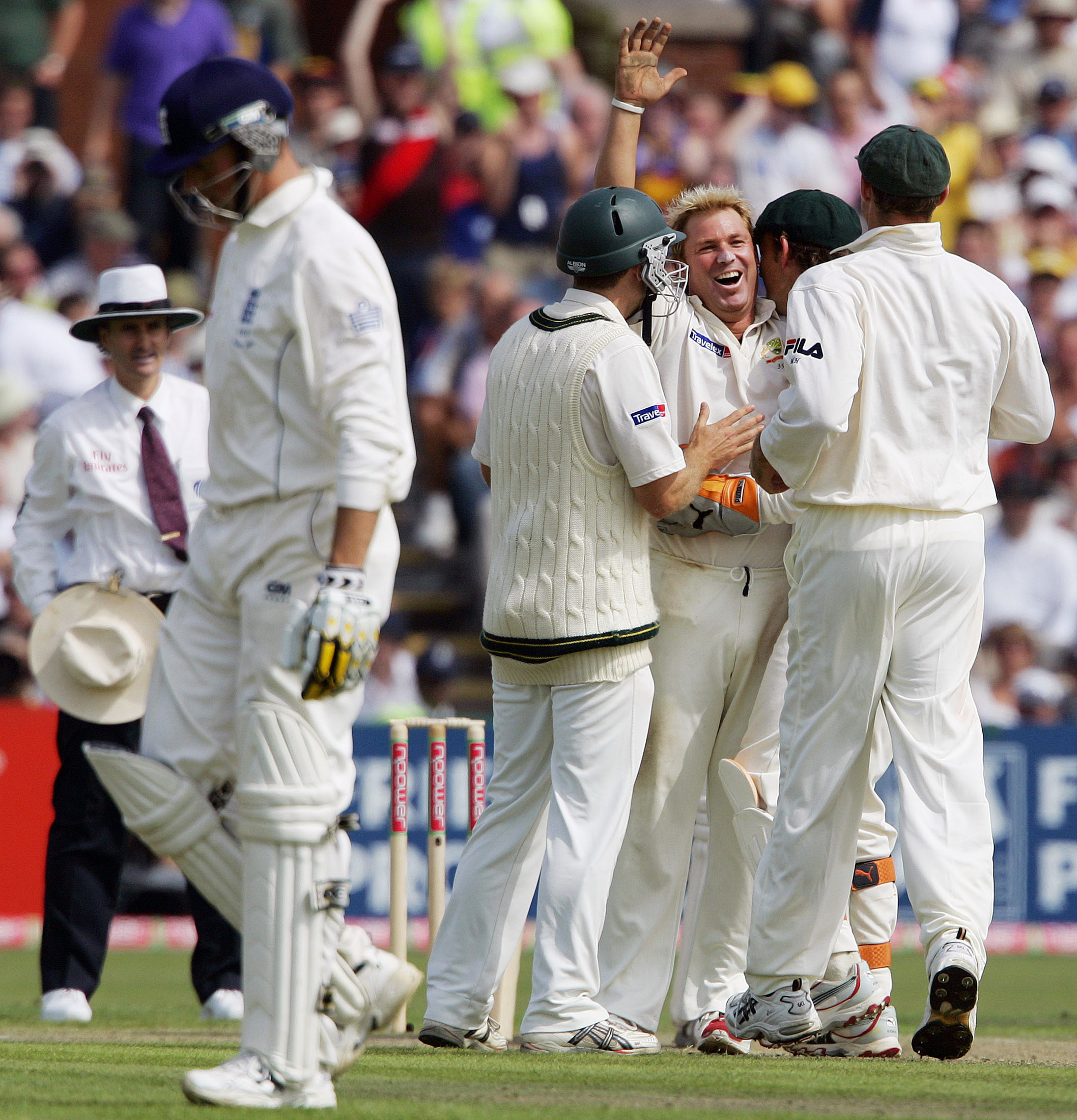 Shane Warne is congratulated by team-mates after taking his 600th test wicket in 2005. Photo:...