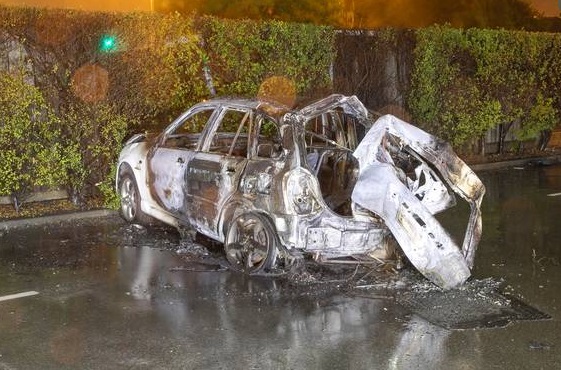 The burnt-out wreckage of a car in which three teens died in Christchurch. Photo / NZ Police