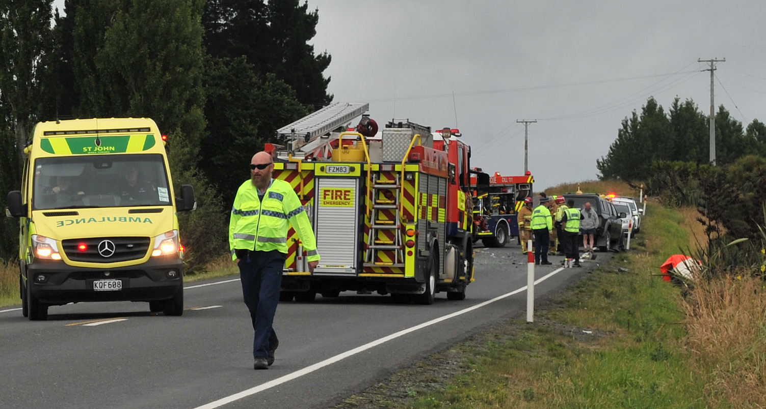 Emergency services at the scene of the crash on New Year's Eve. Photo: Jono Edwards