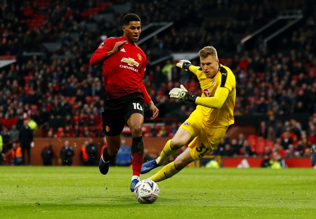 Manchester United's Marcus Rashford tries to get past Reading keeper Anssi Jaakkola. Photo: Reuters