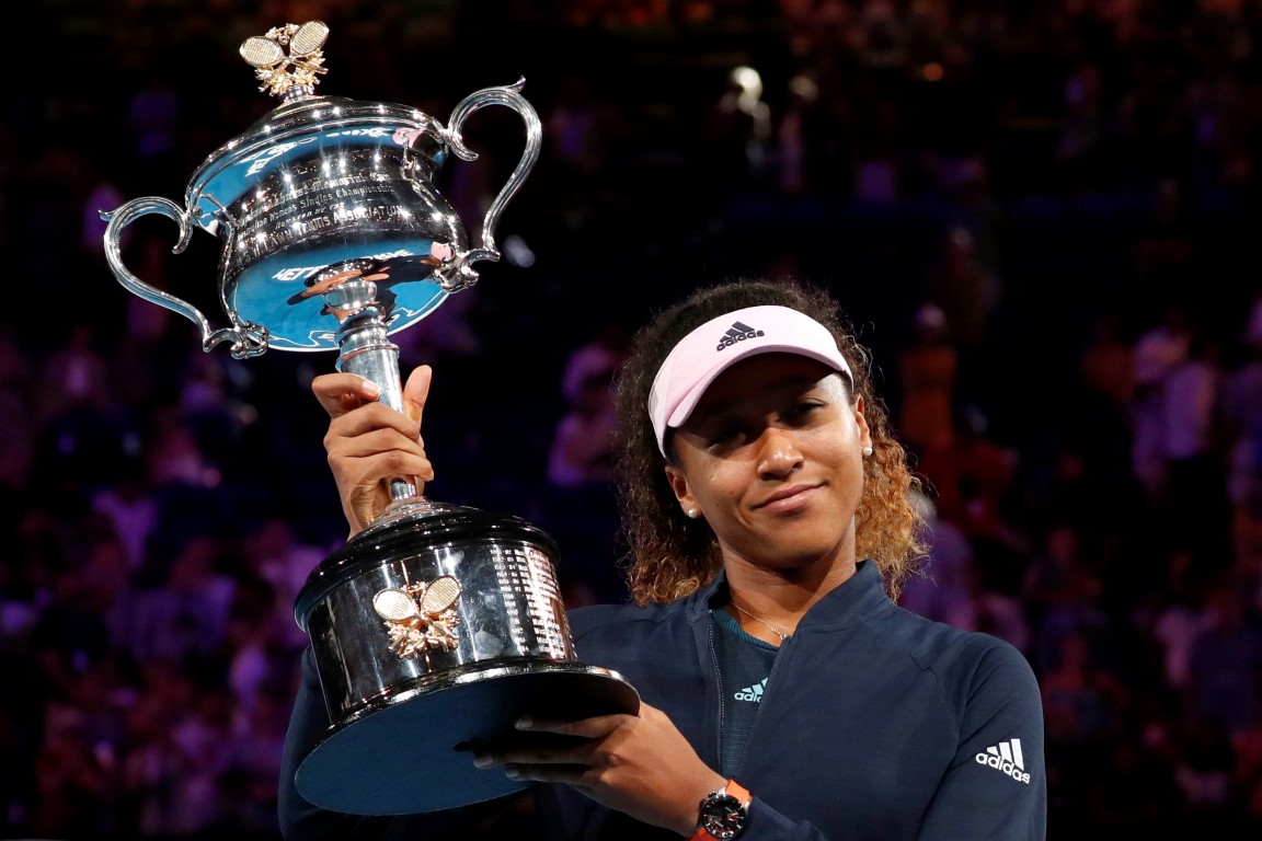 Naomi Osaka poses with the trophy after her victory in the Australian Open final. Photo: Reuters