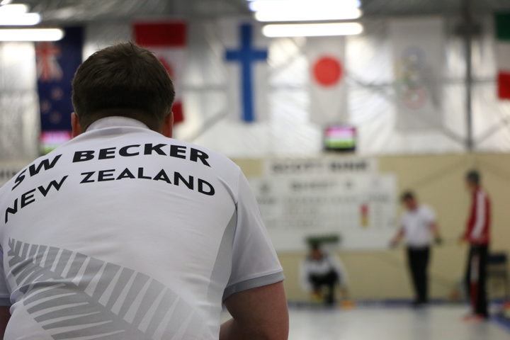 New Zealand men’s skip Scott Becker watches as his teammate prepares to release a stone Photo: RNZ