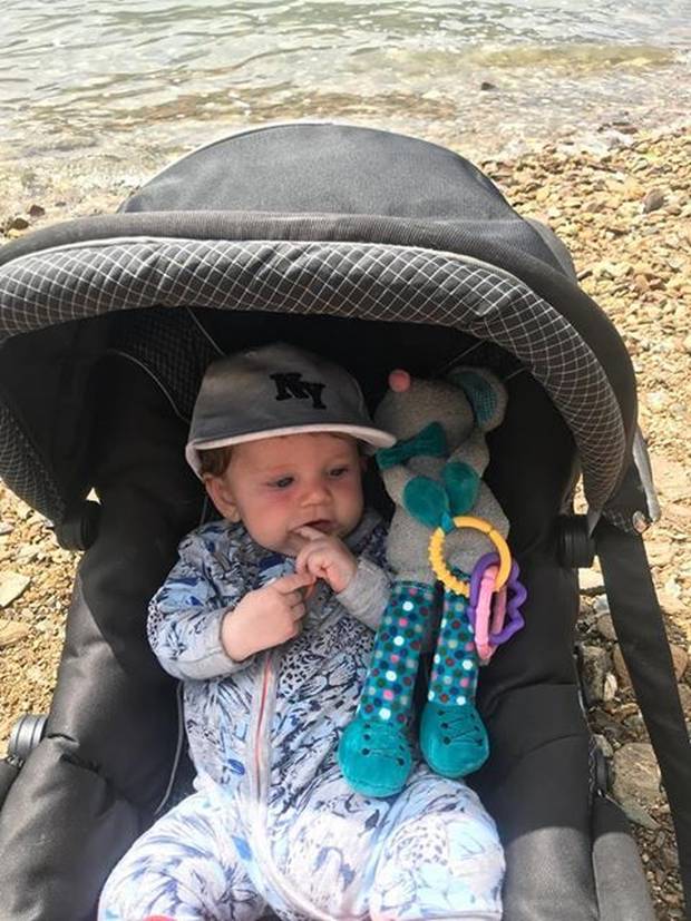 Noah at the beach in the Marlborough Sounds before getting burnt. He was wearing a hat, sunblock...