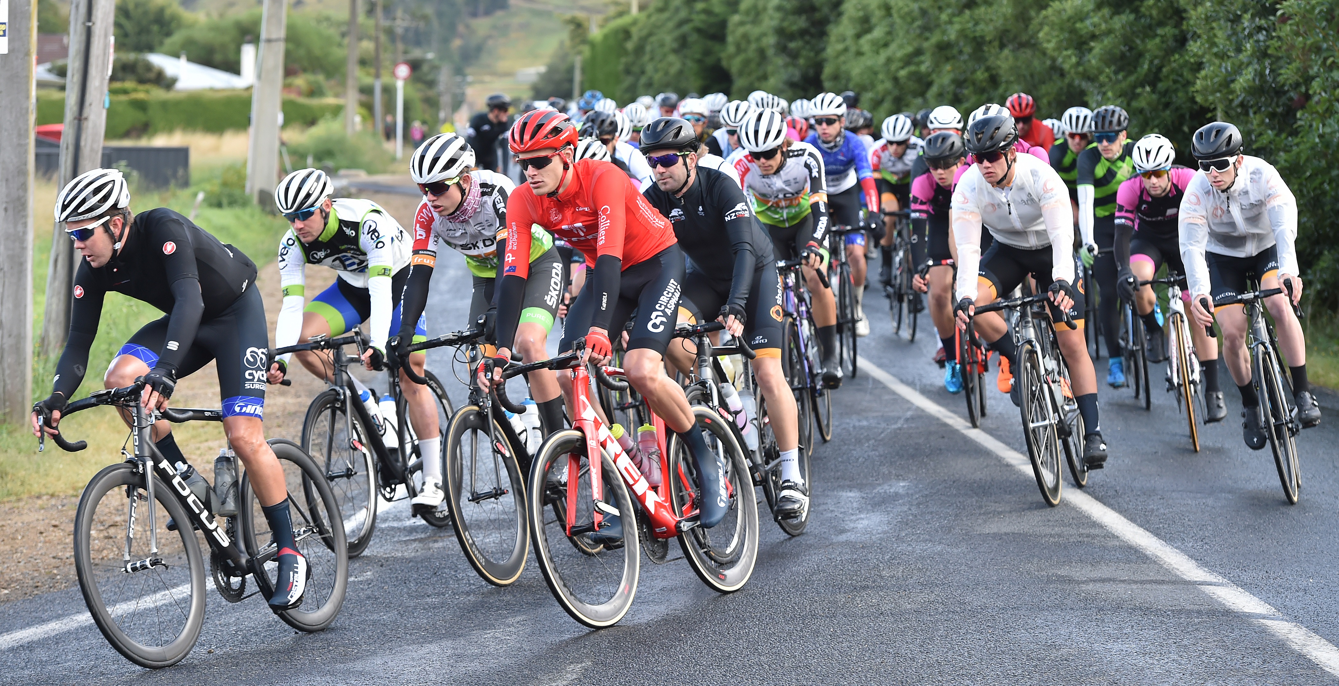 The elite men tackle the first corner at the start of a Calder Stewart Cycling Series race at...