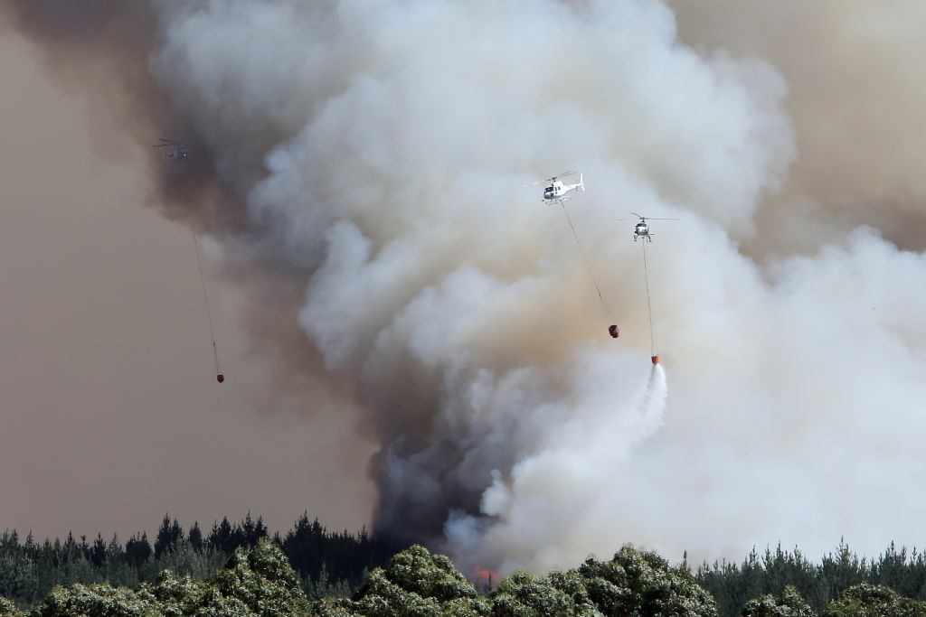 Helicopter crews battle the huge blaze. Photo: Getty