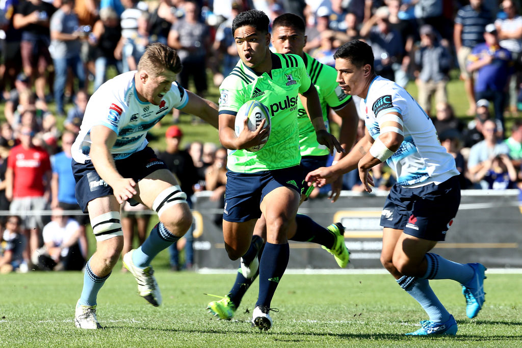 Josh Ioane makes a break for the Highlanders against the Waratahs during their pre-season match...