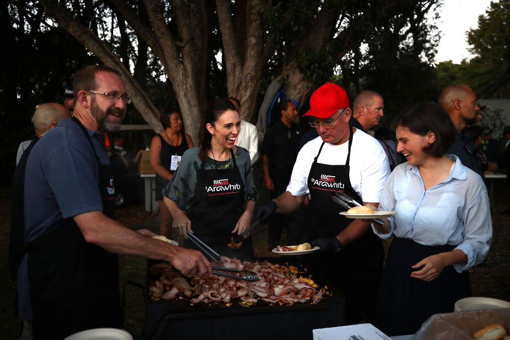 Serving food from the barbeque on the Treaty Ground at Waitangi are (from left) Andrew Little,...