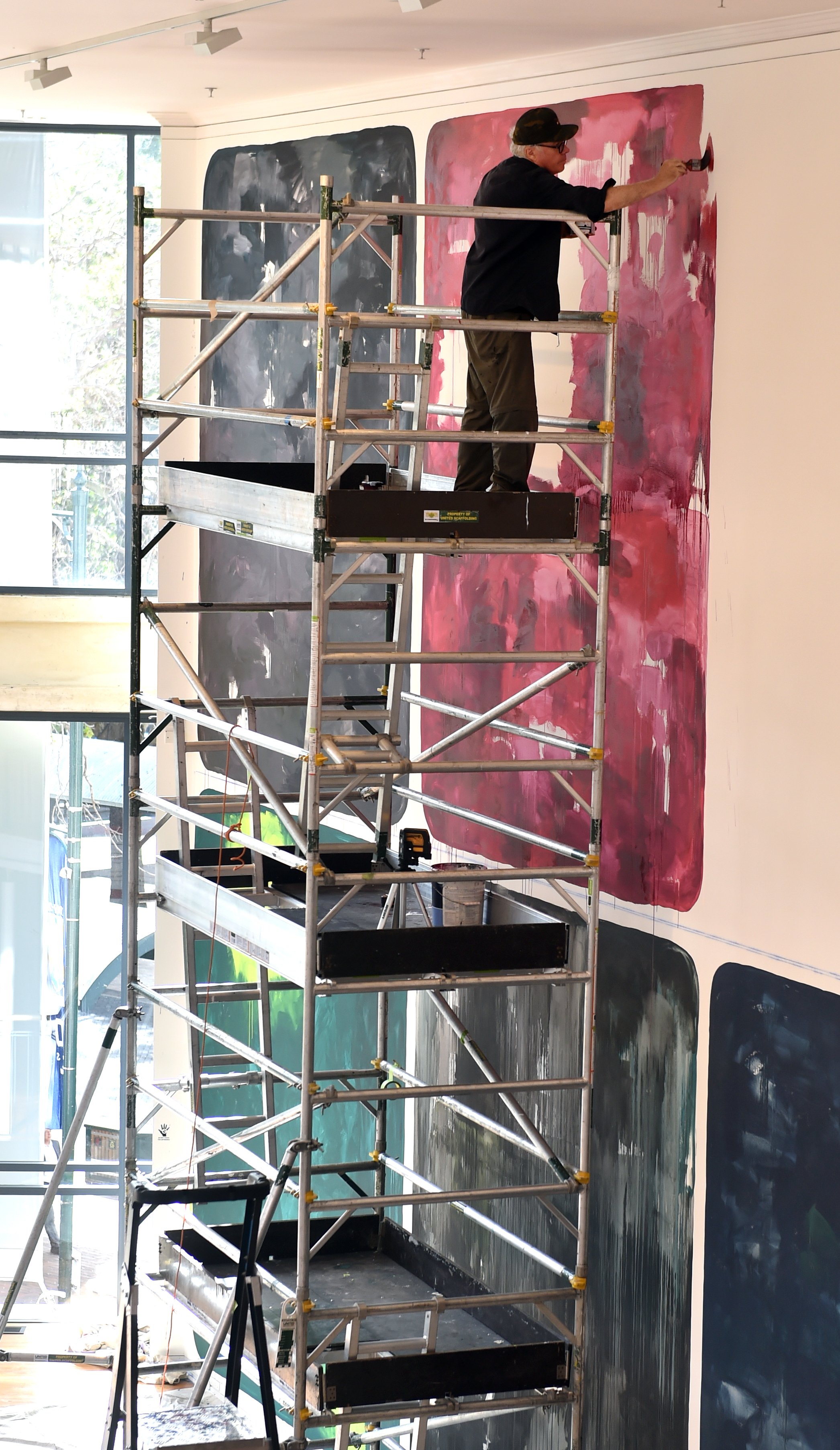 John Reynolds works on underpainting the "big wall" at the Dunedin Public Art Gallery. Photo:...