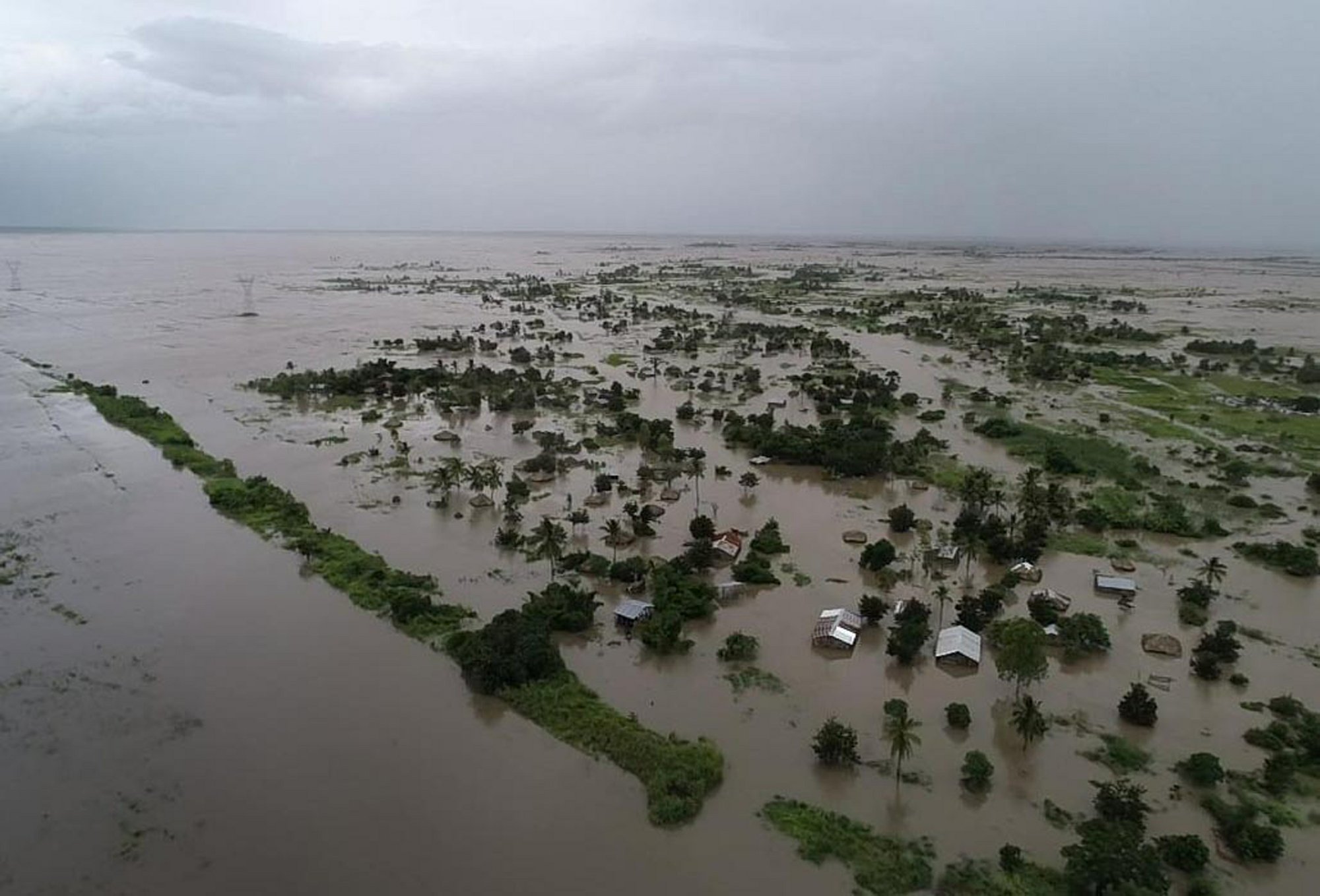 Rapidly rising floodwaters have created "an inland ocean" in the country endangering many...