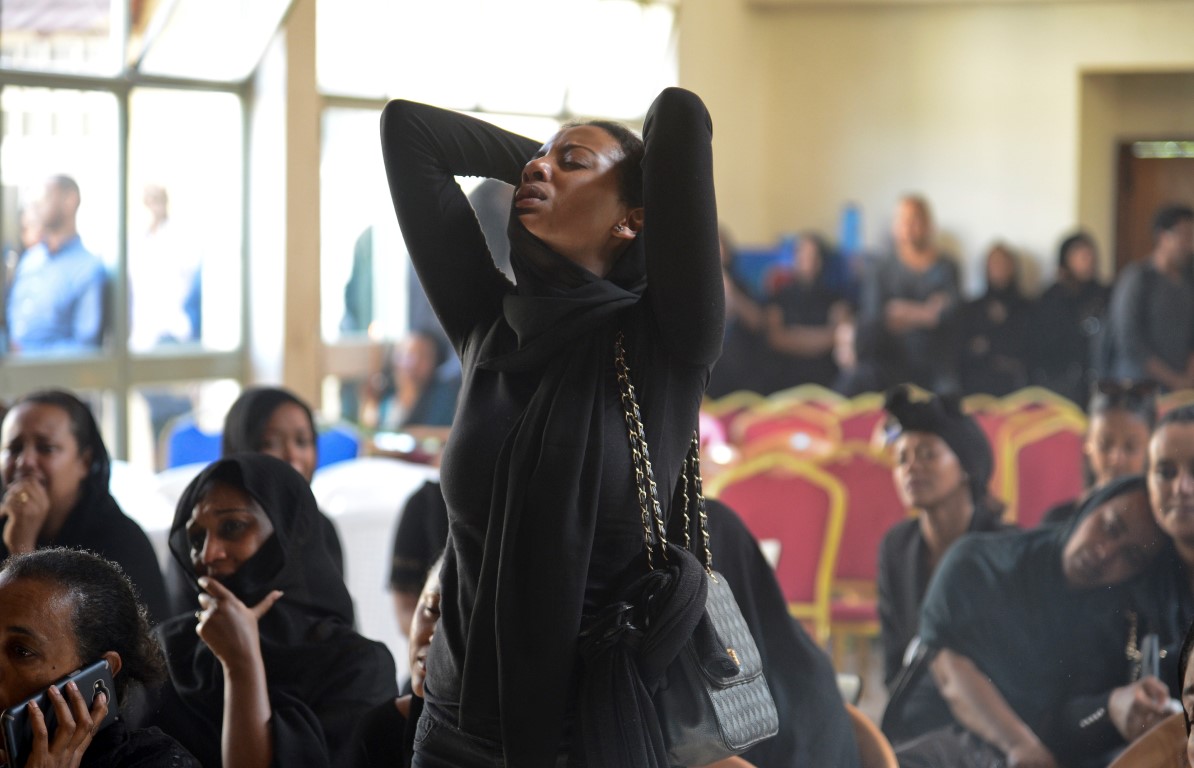 Mourners attend a memorial service held by an association of Ethiopian airline pilots in Addis...