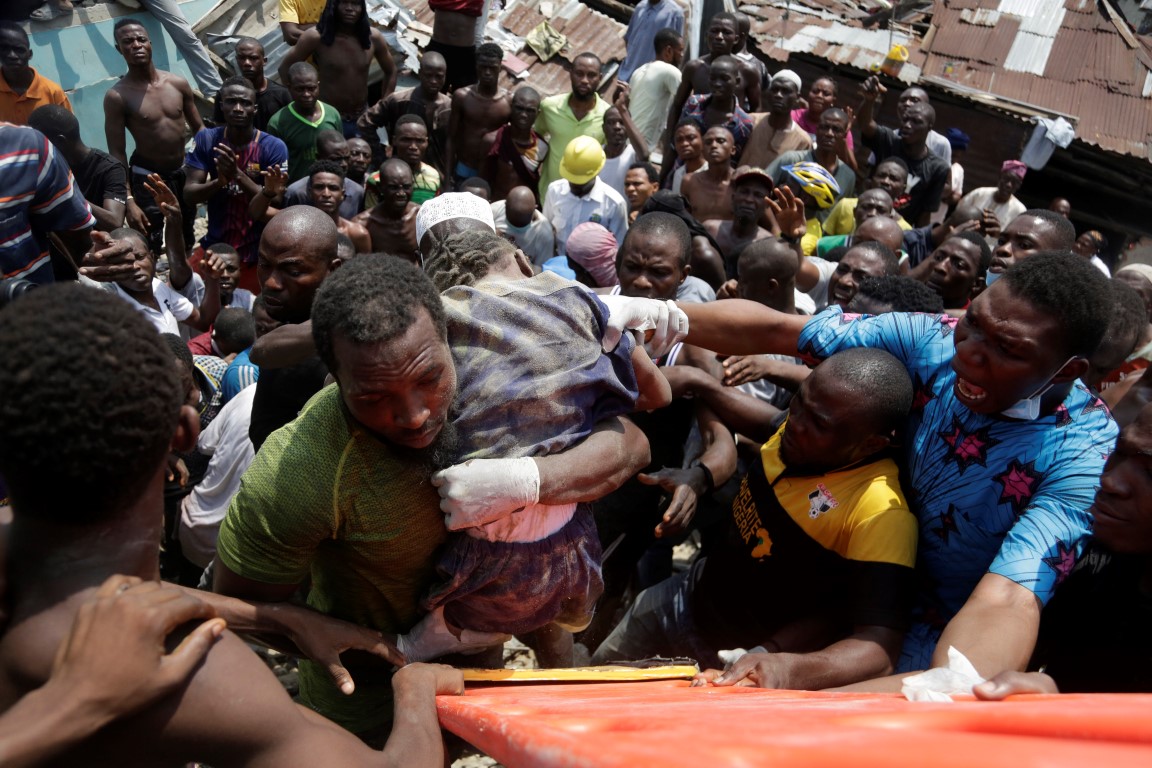 A child is rescued from the rubble of the collapsed building in Lagos. Photo: AP