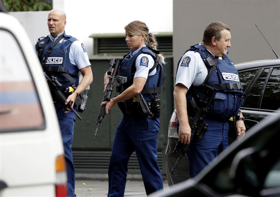 Armed police patrol in central Christchurch after the shooting. Photo: AP