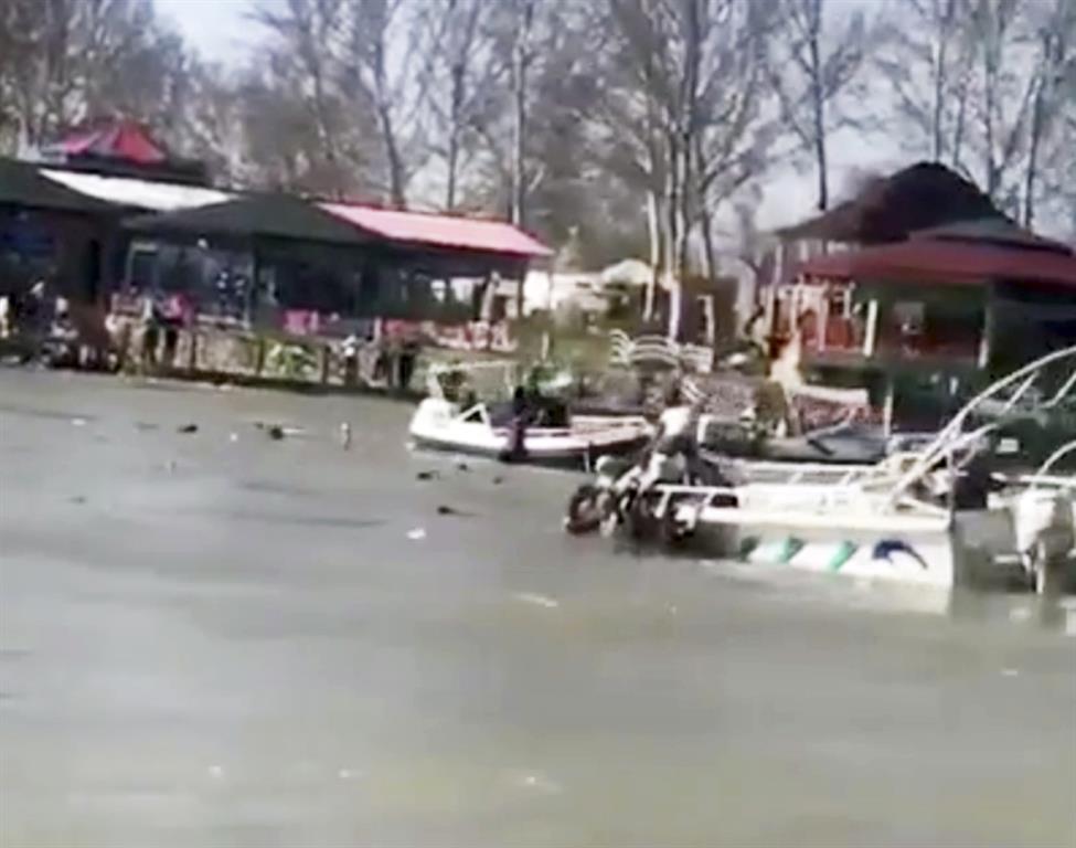 Rescue efforts under way in the Tigris River after the ferry sank, in this image taken from video...