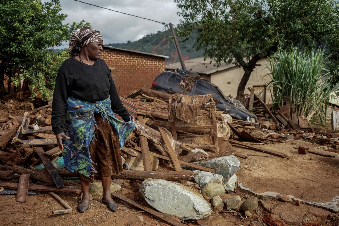 A woman who lost her daughter-in-law and three grandchildren to Cyclone Idai-induced rains stands...