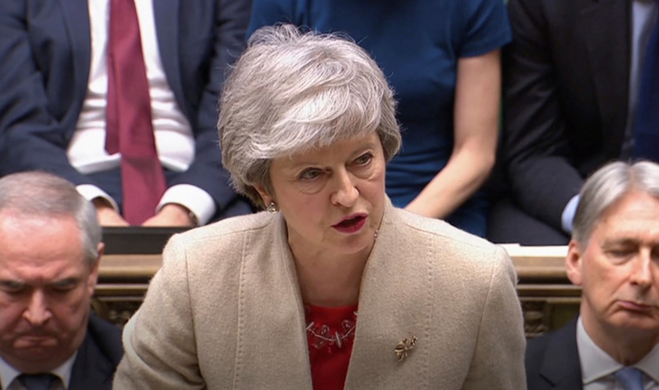 British Prime Minister Theresa May speaks to lawmakers after the government's Brexit withdrawal...