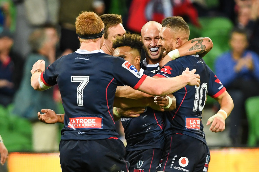 Rebels players celebrate their win over the Brumbies. Photo: Getty 