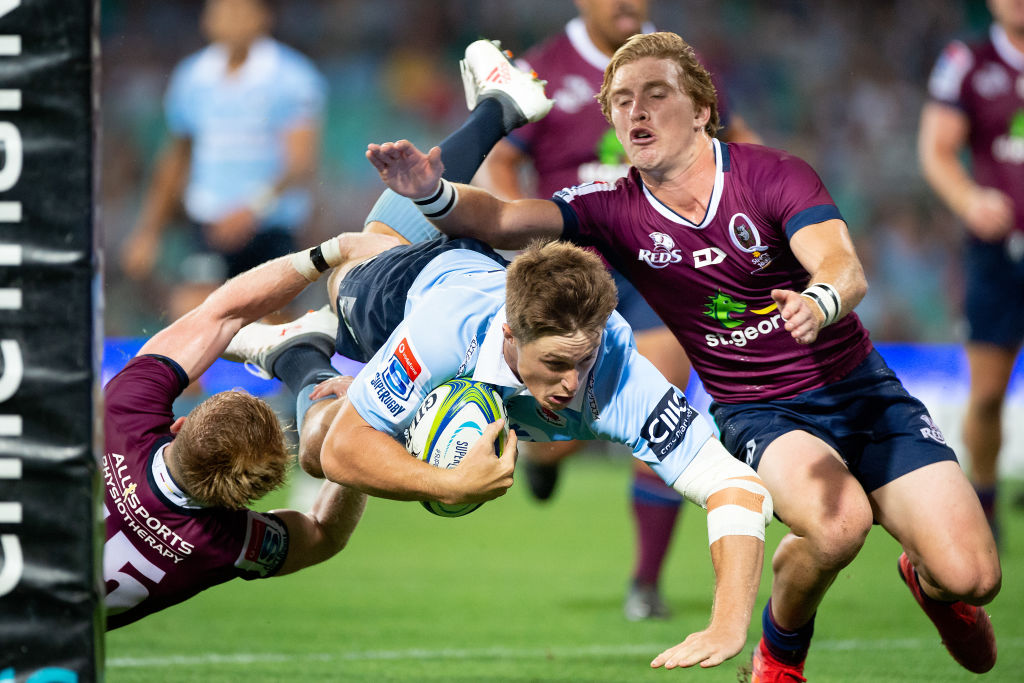 Alex Newsome dives across to score for the Waratahs. Photo: Getty