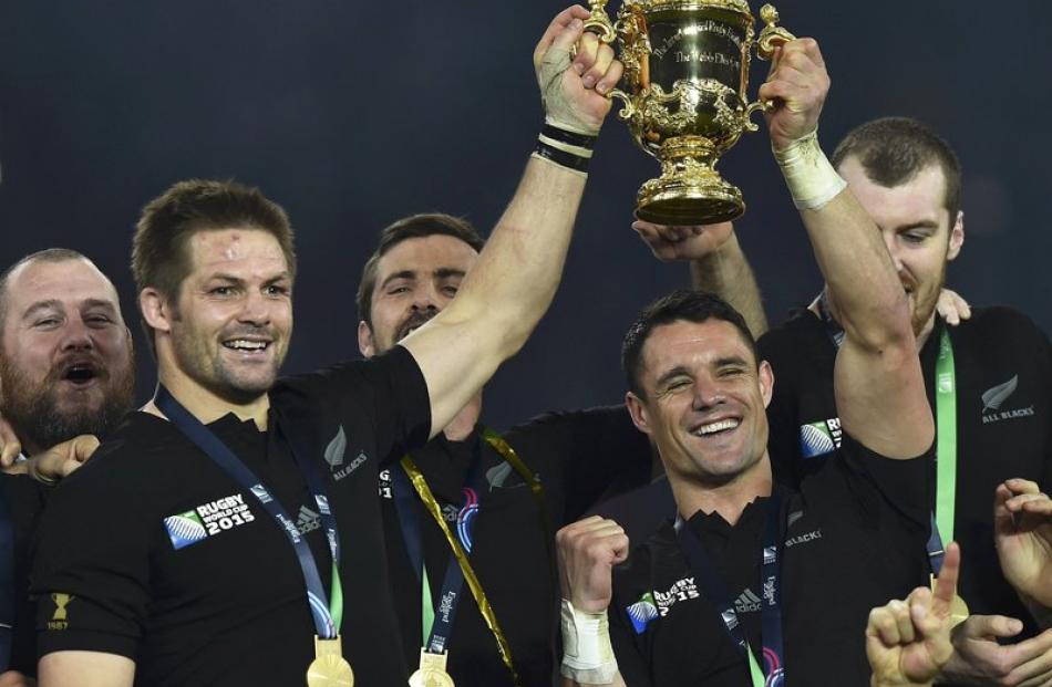 Richie McCaw and Dan Carter lift the trophy after winning the 2015 Rugby World Cup. Photo: Reuters