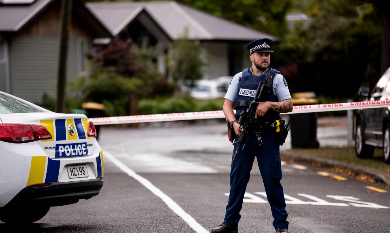 A police officer stands guard at the scene where a man died of stab wounds in Christchurch. Photo...