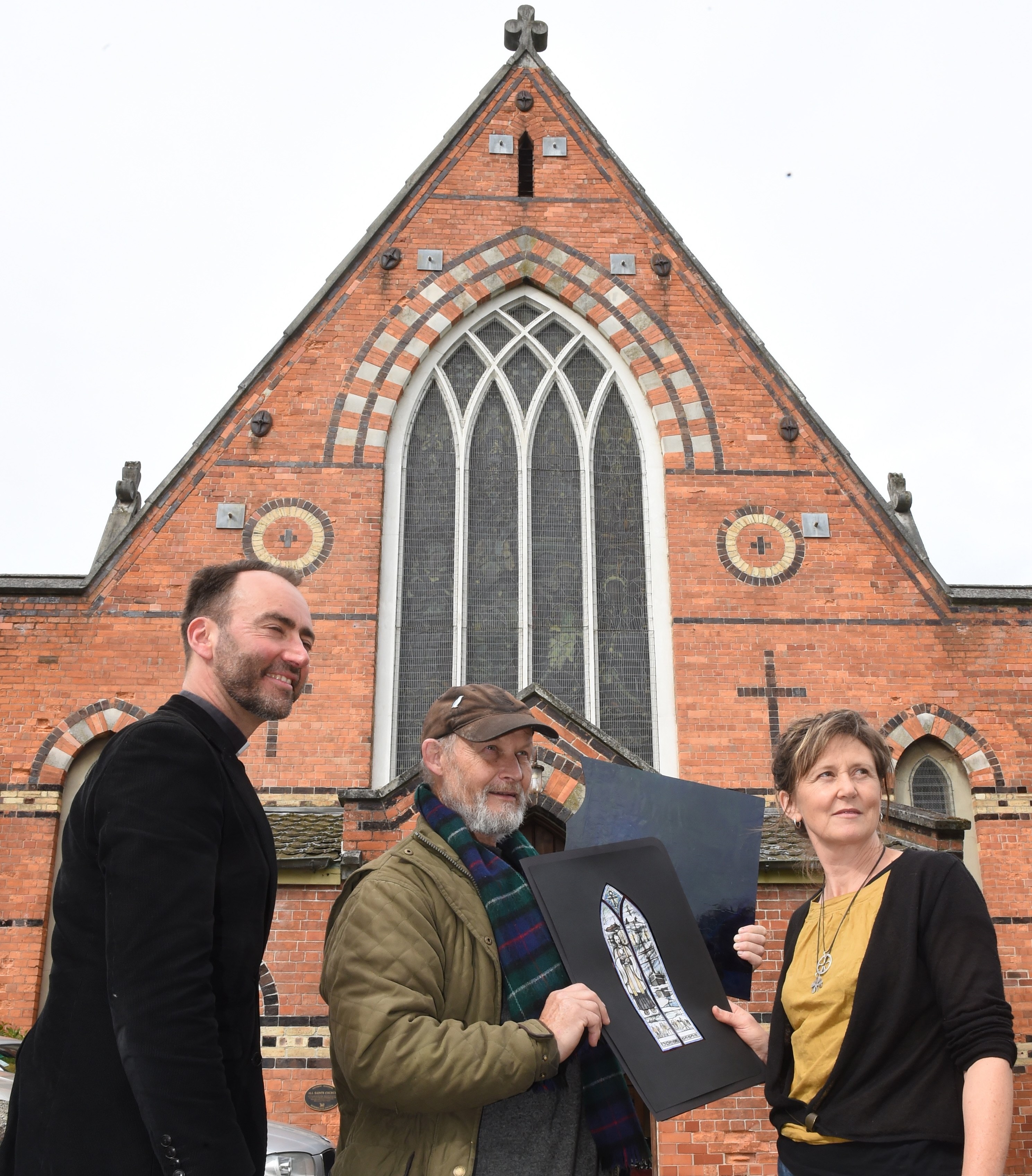 All Saints' Anglican Church vicar Canon Michael Wallace (left), stained-glass-maker Peter...