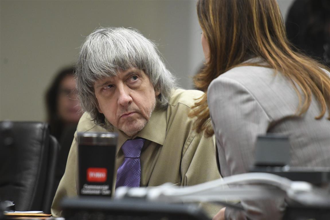 David Turpin listens to his attorney, Allison Lowe, during a sentencing hearing in Riverside,...