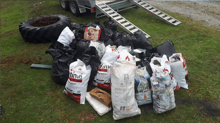 Bags filled with litter after volunteers helped with a clean-up today. Photo: South Westland...