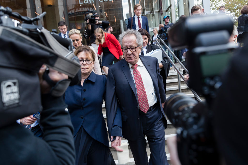 Geoffrey Rush and his wife Jane Menelaus leave the Supreme Court of New South Wales in Sydney...