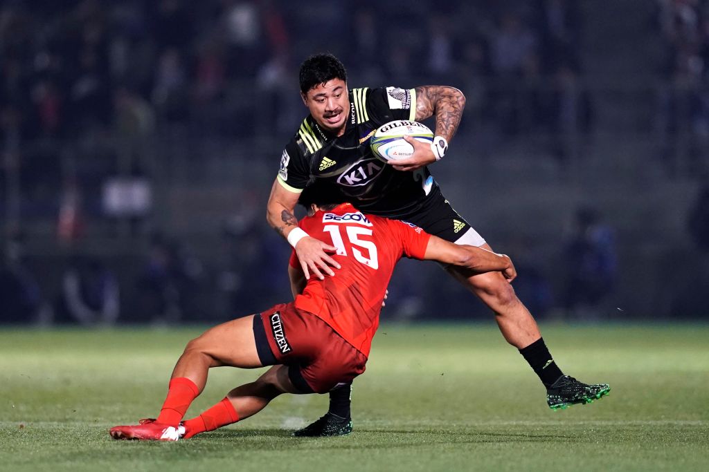 The Hurricanes' Ben Lam is tackled by the Sunwolves' Ryohei Yamanaka. Photo: Getty