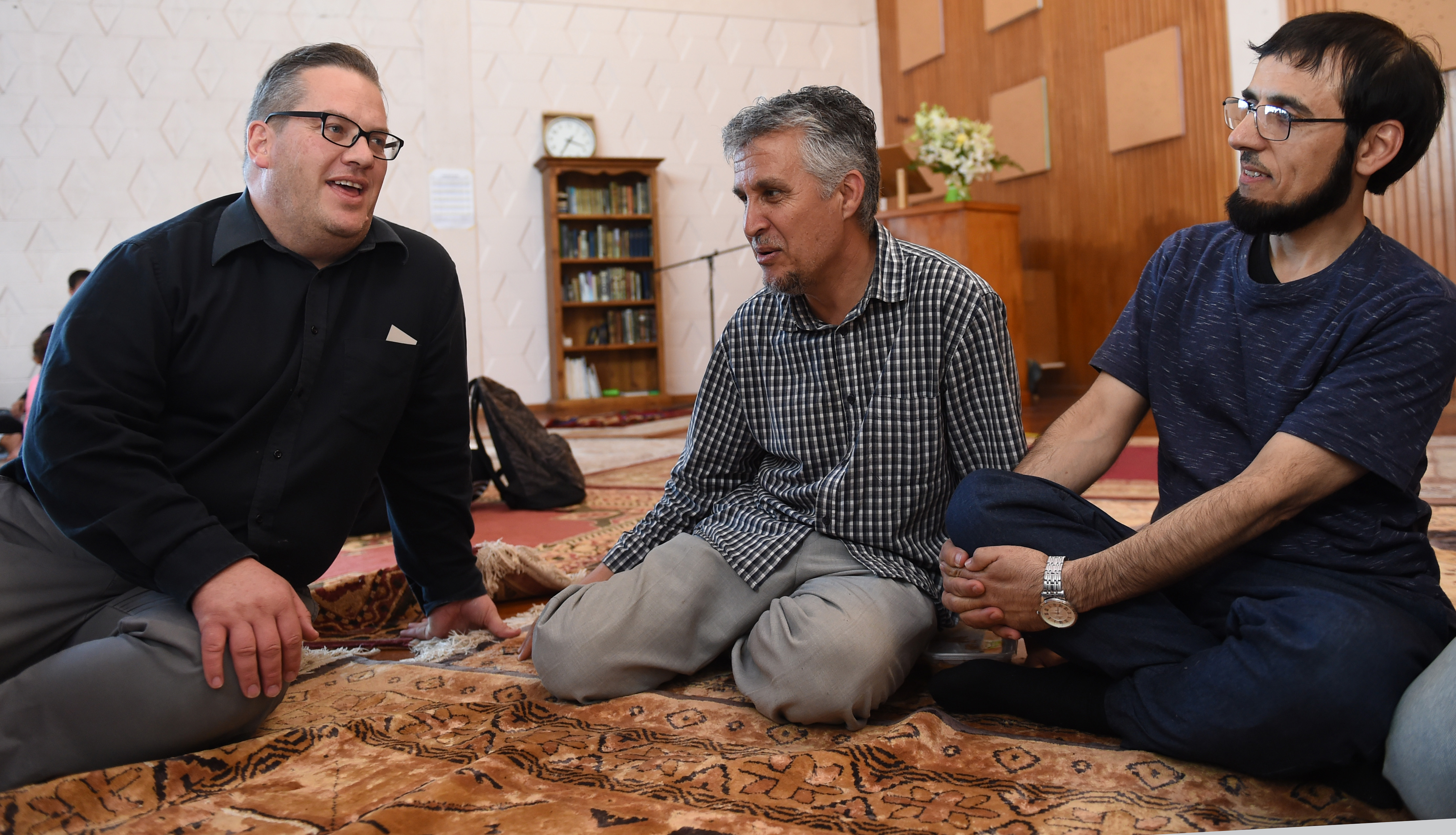 Enjoying the open day at Al Huda mosque in Dunedin yesterday are (from left) Charles Shaw, Essa...