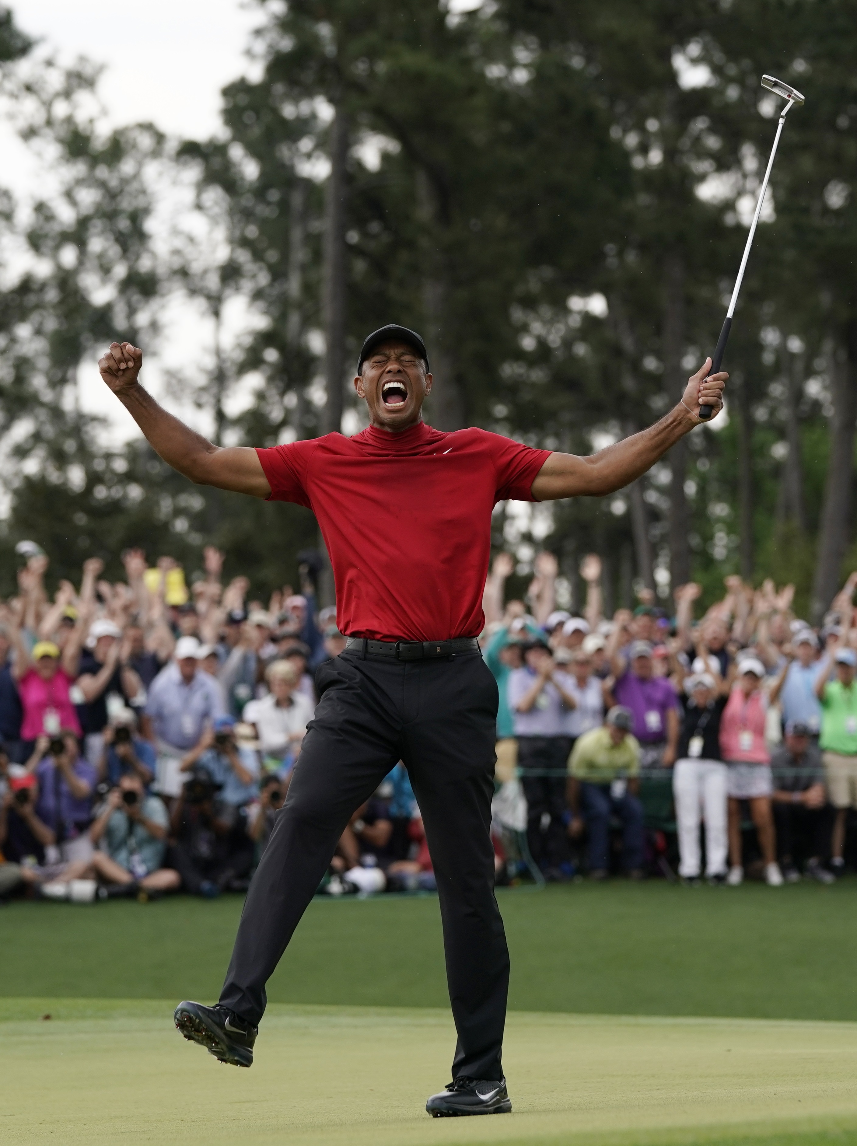 An ecstatic Tiger Woods celebrates his win at Augusta. Photo: AP