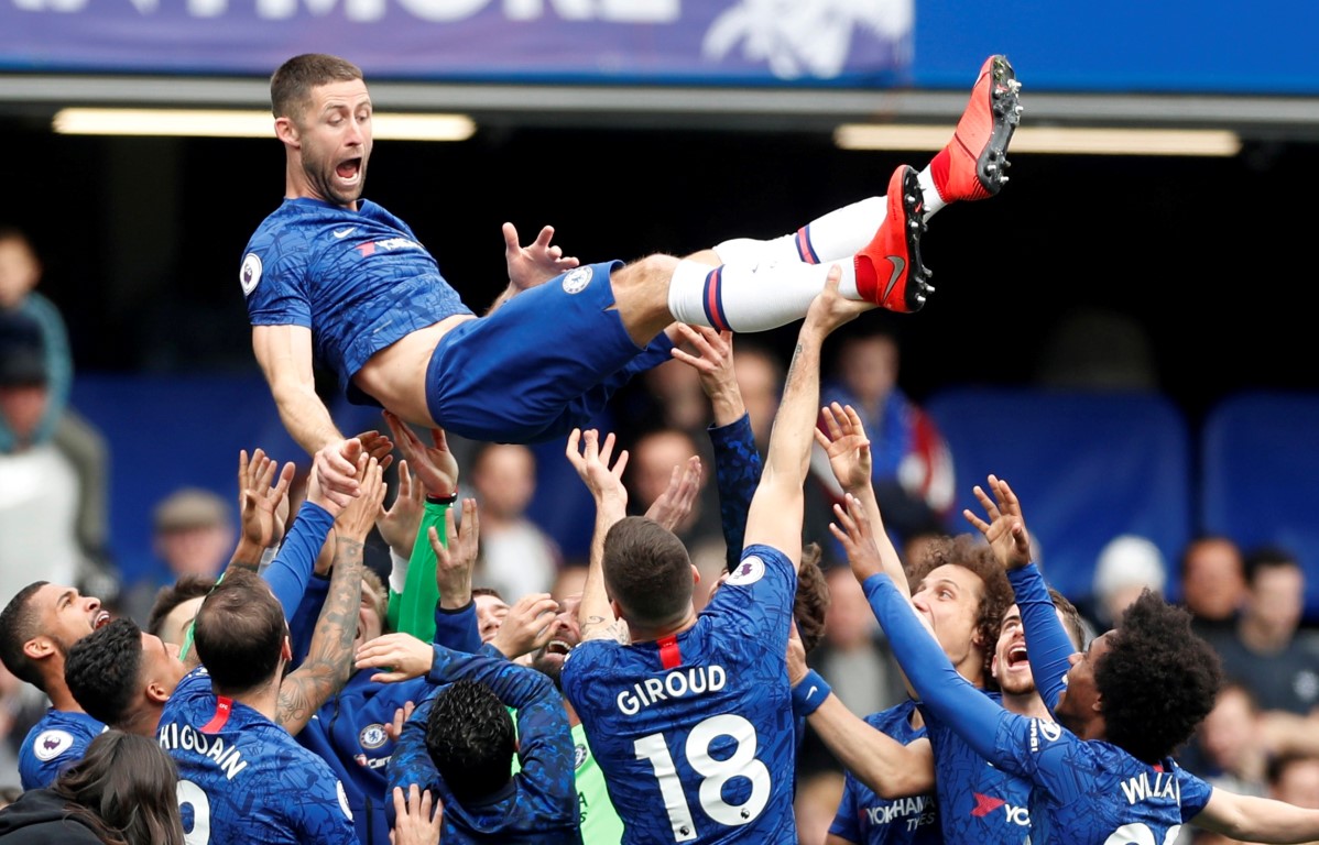 Chelsea's Gary Cahill is thrown in the air by his teammates after the match. Photo: Reuters