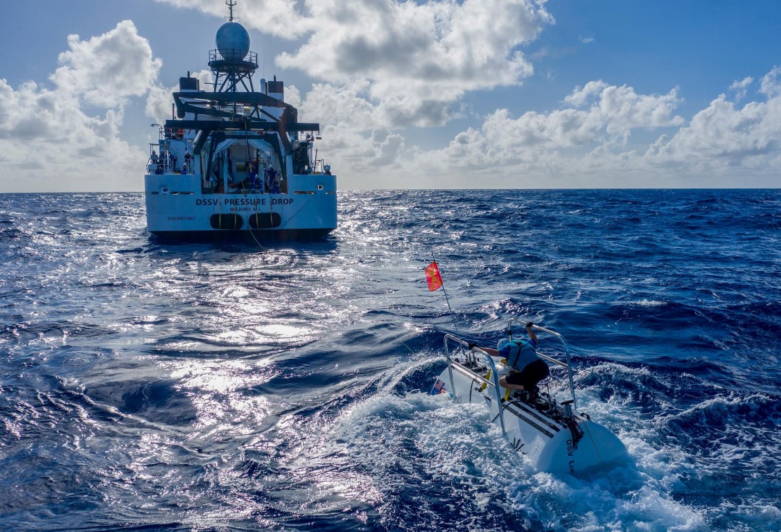 The submarine DSV Limiting Factor floats near the research vessel DSSV Pressure Drop above the...