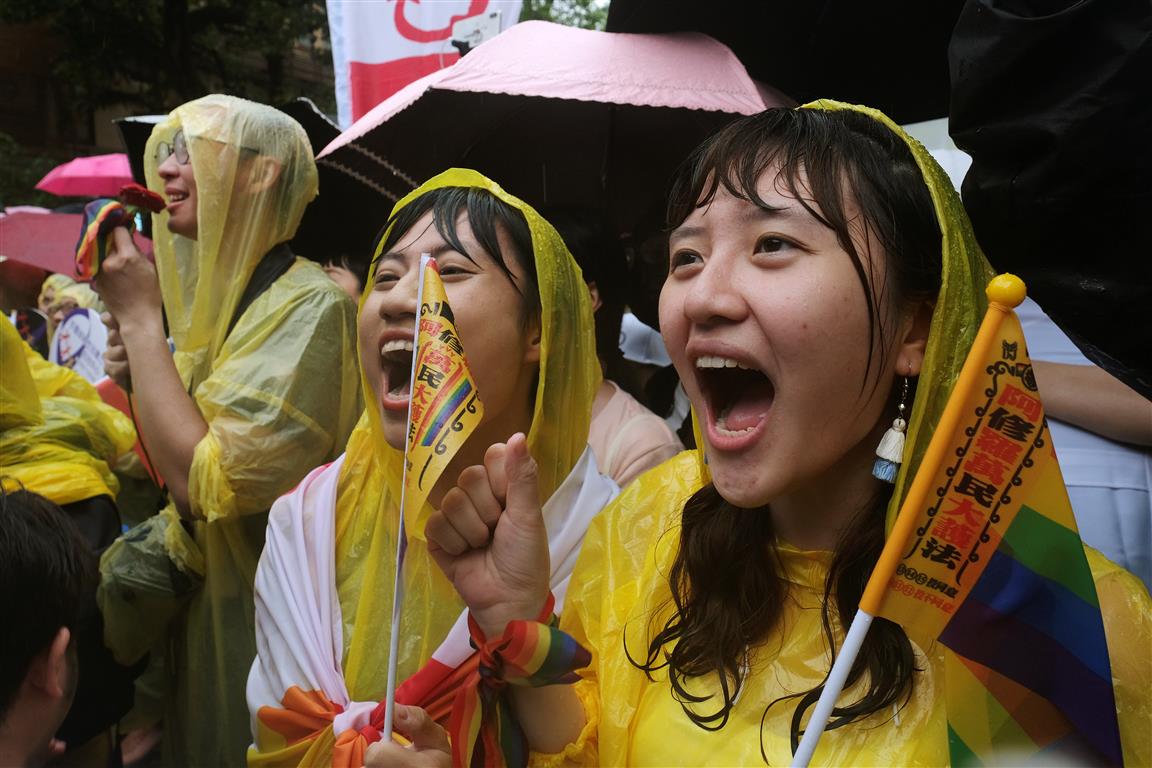 Same-sex marriage supporters shout during a parliamentary vote a same-sex marriage law, outside...