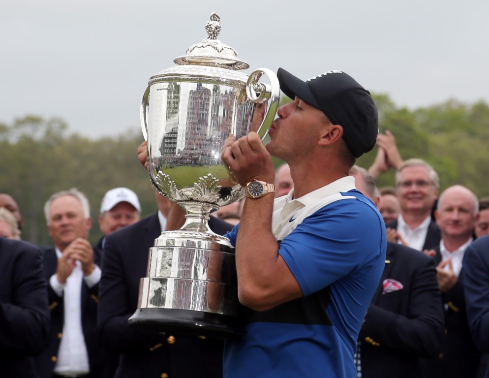 Brooks Koepka celebrates with the Wanamaker Trophy after his victory. Photo: Peter Casey-USA...