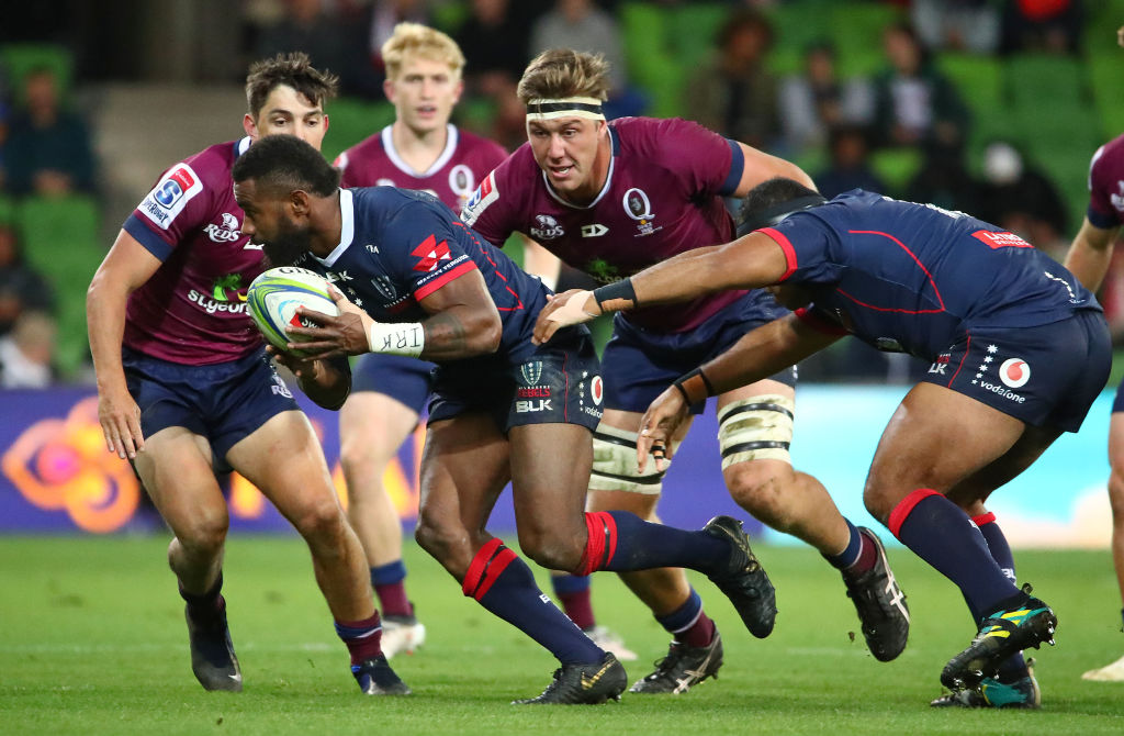 The Rebels' Marika Koroibete runs the ball up against the Reds. Photo: Getty Images