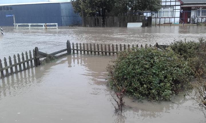 Flooding at the Lamberts' front fence. Photo: Lambert family via RNZ