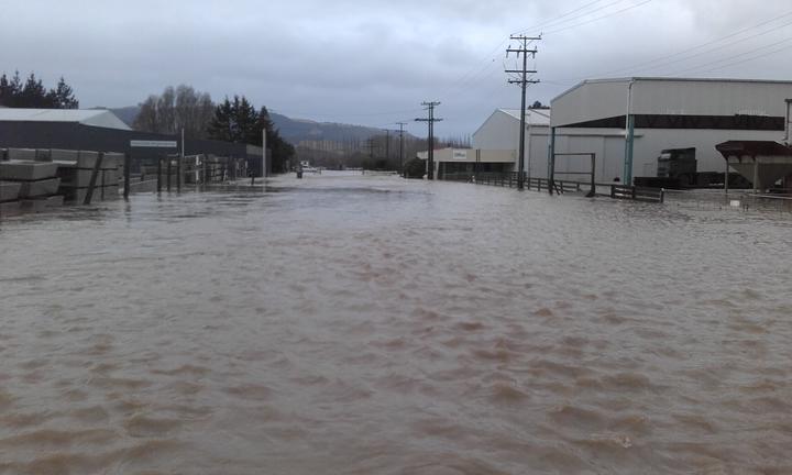 Flooding on the Lamberts' street during one of the floods. Photo: RNZ / Supplied