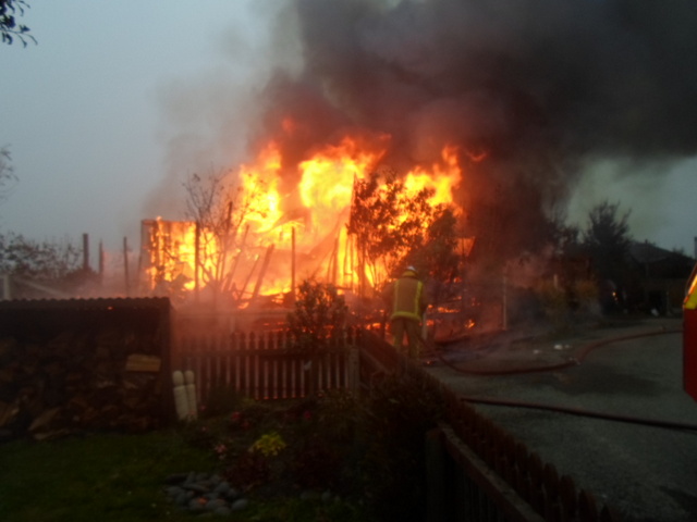 Firefighters battle a house fire at Riverside Village in Glenavy. Photo: supplied