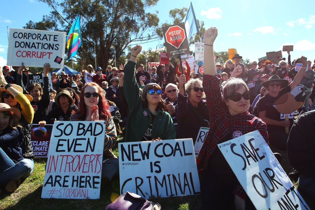 Activists take part in an anti-Adani rally outside Australia's Parliament House in Canberra last...