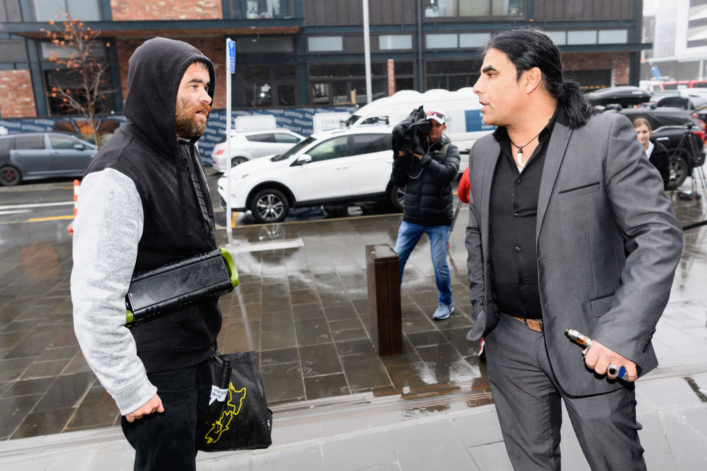 Abdul Aziz (R) confronts a member of the public who backed white supremacist views in front of...