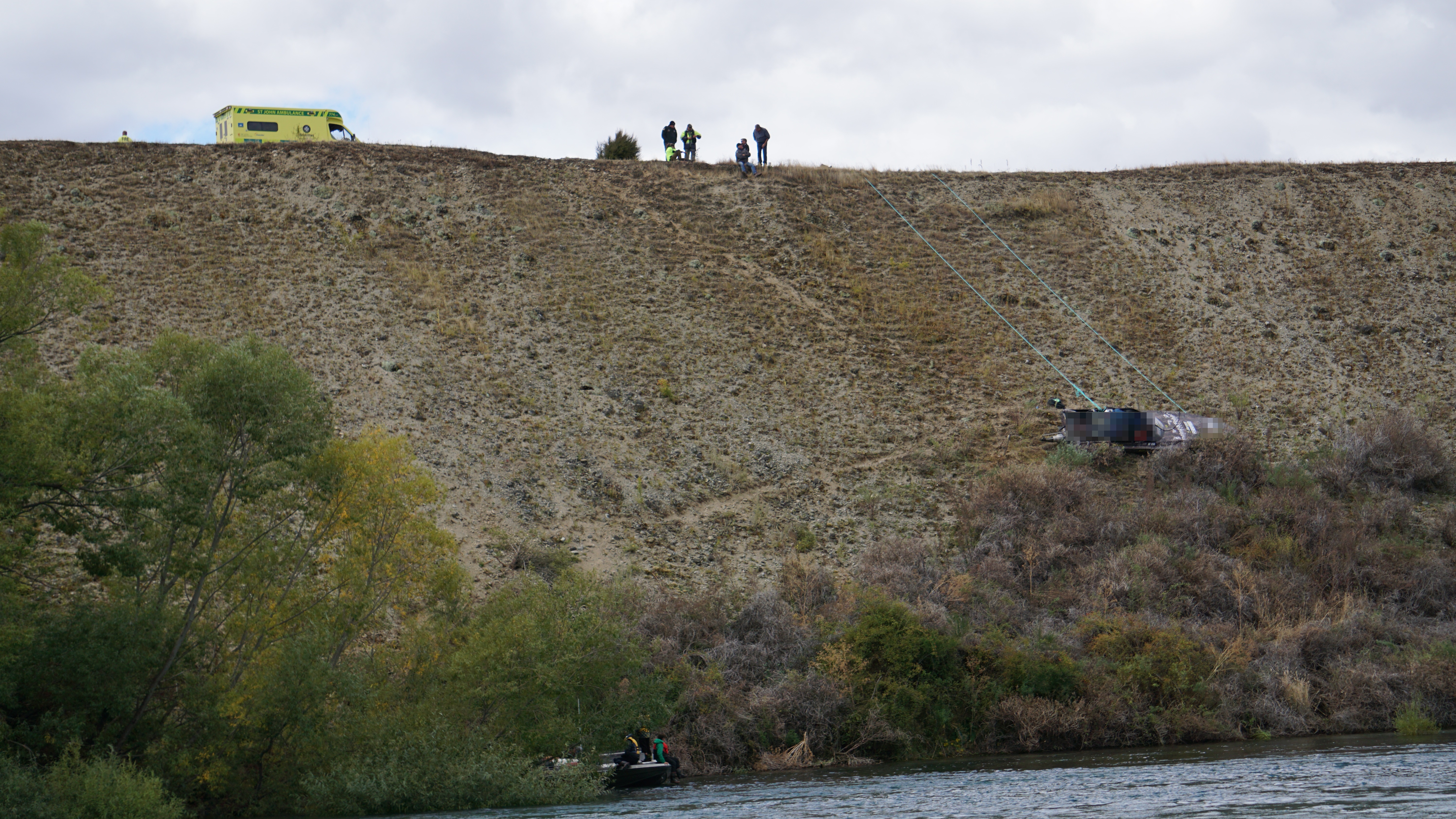 Emergency services attend the scene of a jet boat crash this afternoon on a stretch of the Clutha...