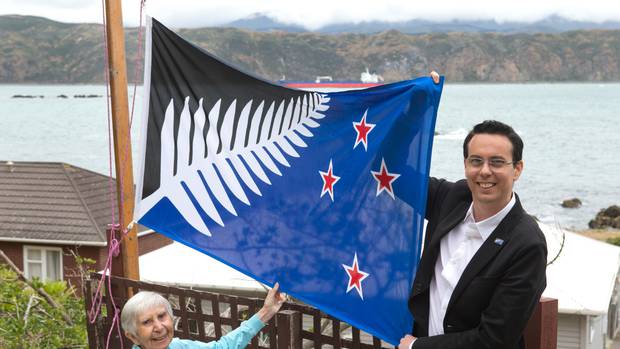 Kyle Lockwood and his grandmother Kathy Lockwood with his flag design that was put against the...
