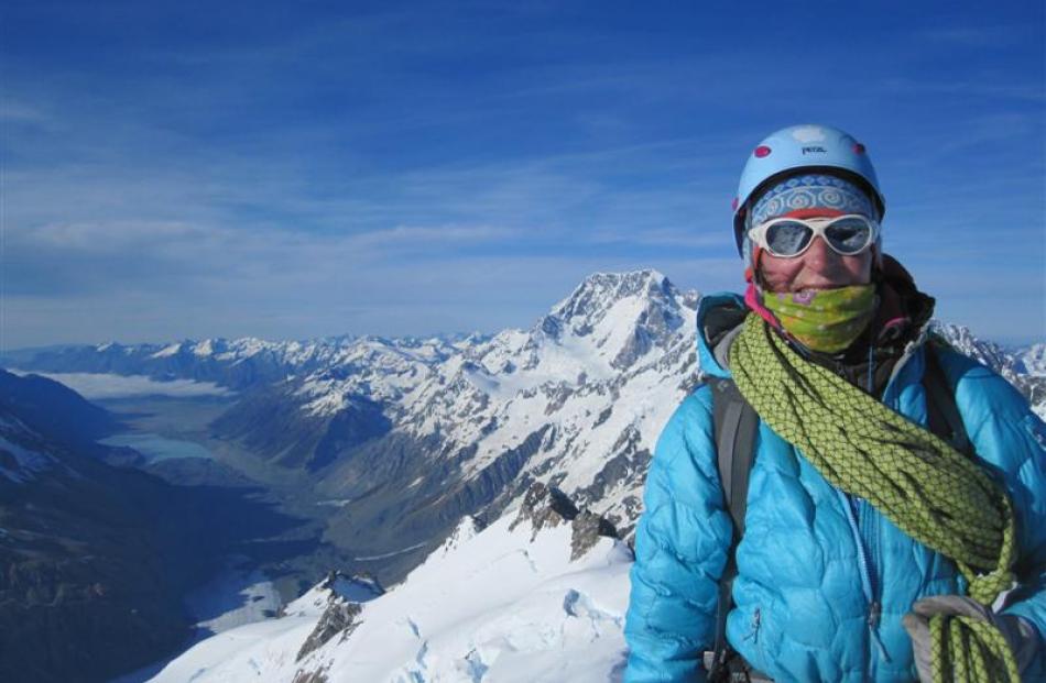 Lydia Bradey climbing in New Zealand on the Minarets, with Aoraki/Mt Cook in the background....