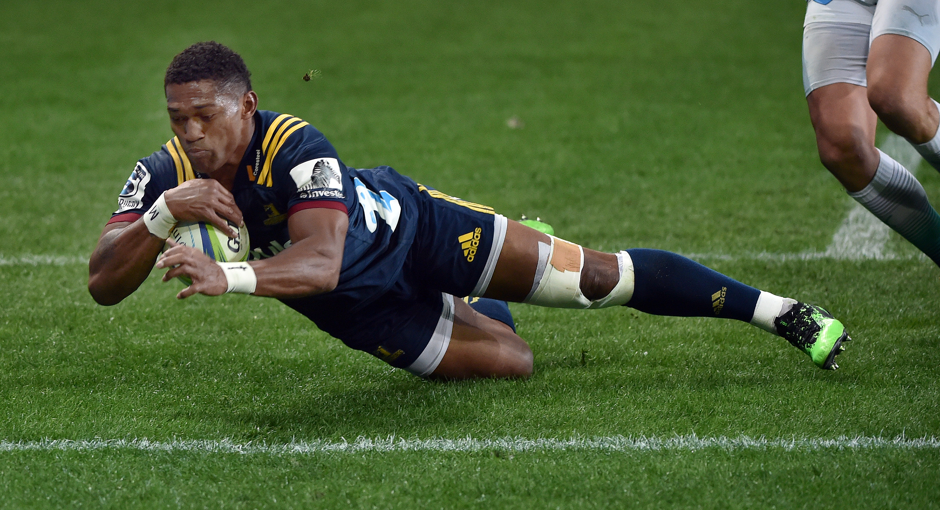 Highlander Waisake Naholo scores one of his two tries.  PHOTO: PETER MCINTOSH