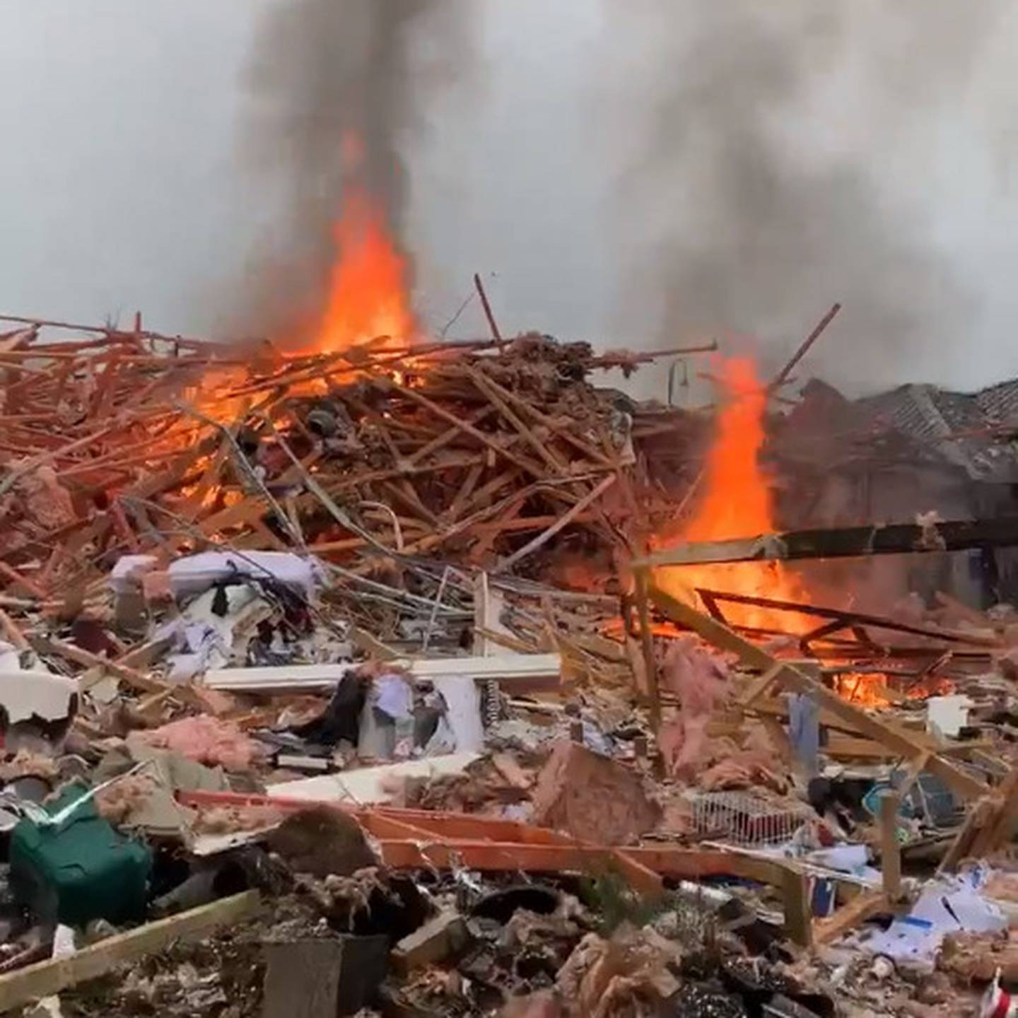 The blast destroyed one house and injured several people. Photo: James Looyer via NZ Herald