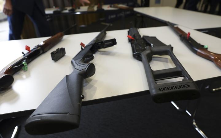 Banned firearms on display at police media conference. Photo: RNZ